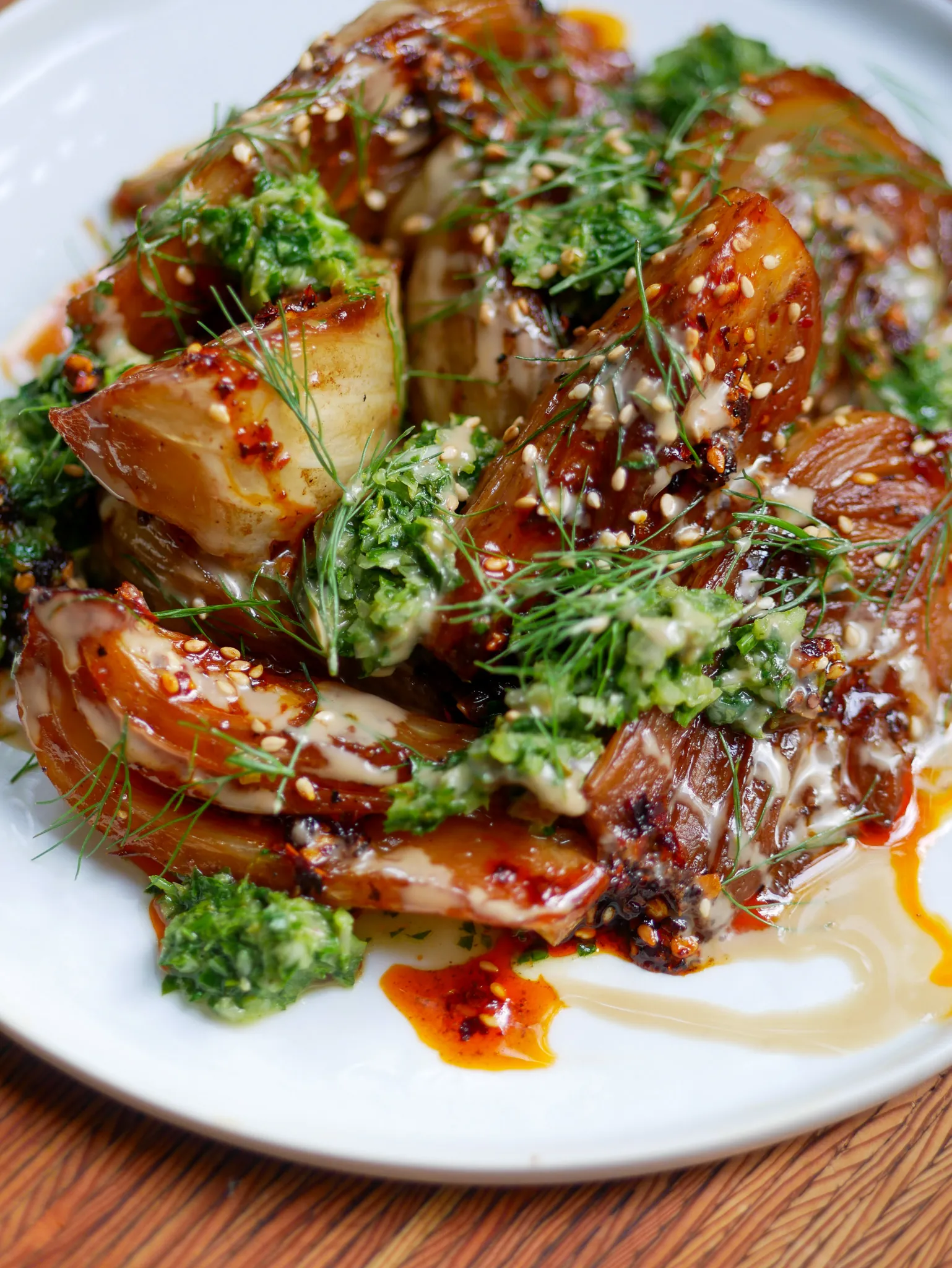 Caramelized Japanese yams with herby chimichurri and creamy garlic sauce.