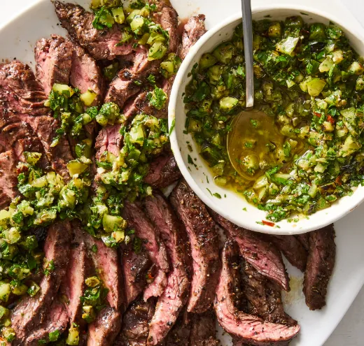 Sliced chimichurri-marinated skirt steak with fresh herby chimichurri.