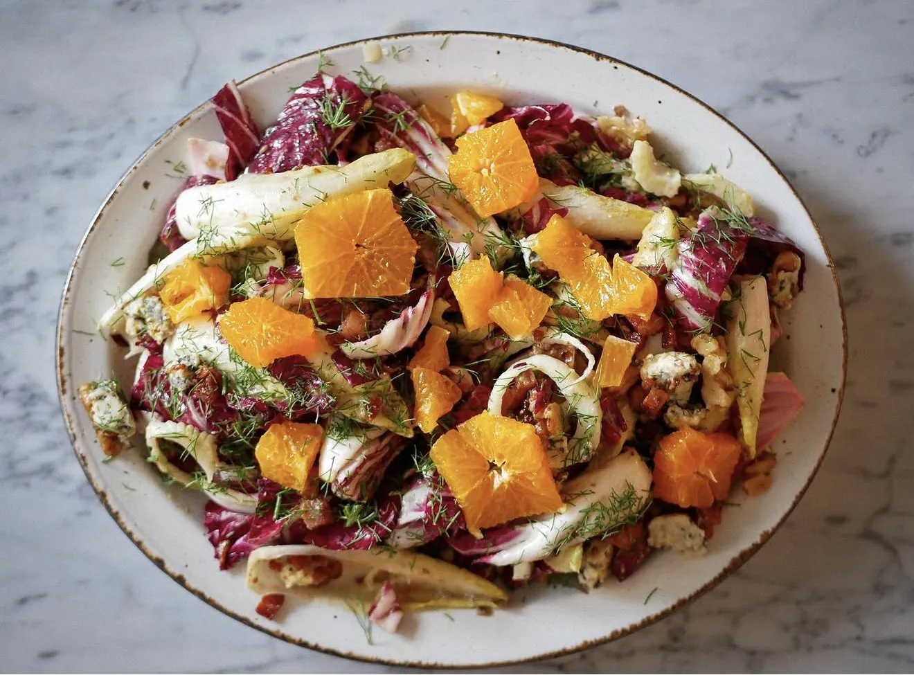 Summer chopped salad with Persian cucumbers, radishes, Sungold tomatoes, corn salsa, crispy chickpeas, and herby probiotic ranch.